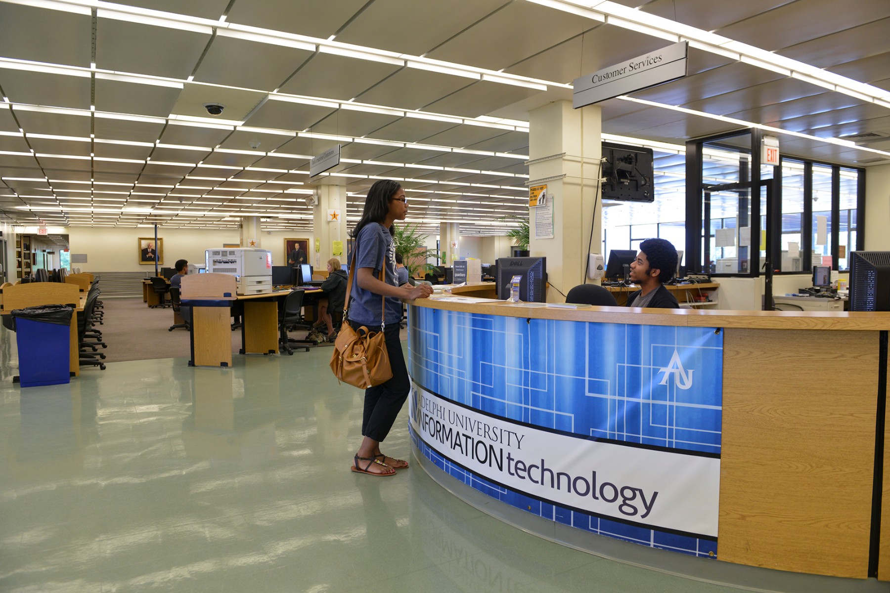 A picture of the IT Help Desk. Located on the second floor of Swirbul Library, the IT Help team offers training and support services if you need assistance with campus related technology.